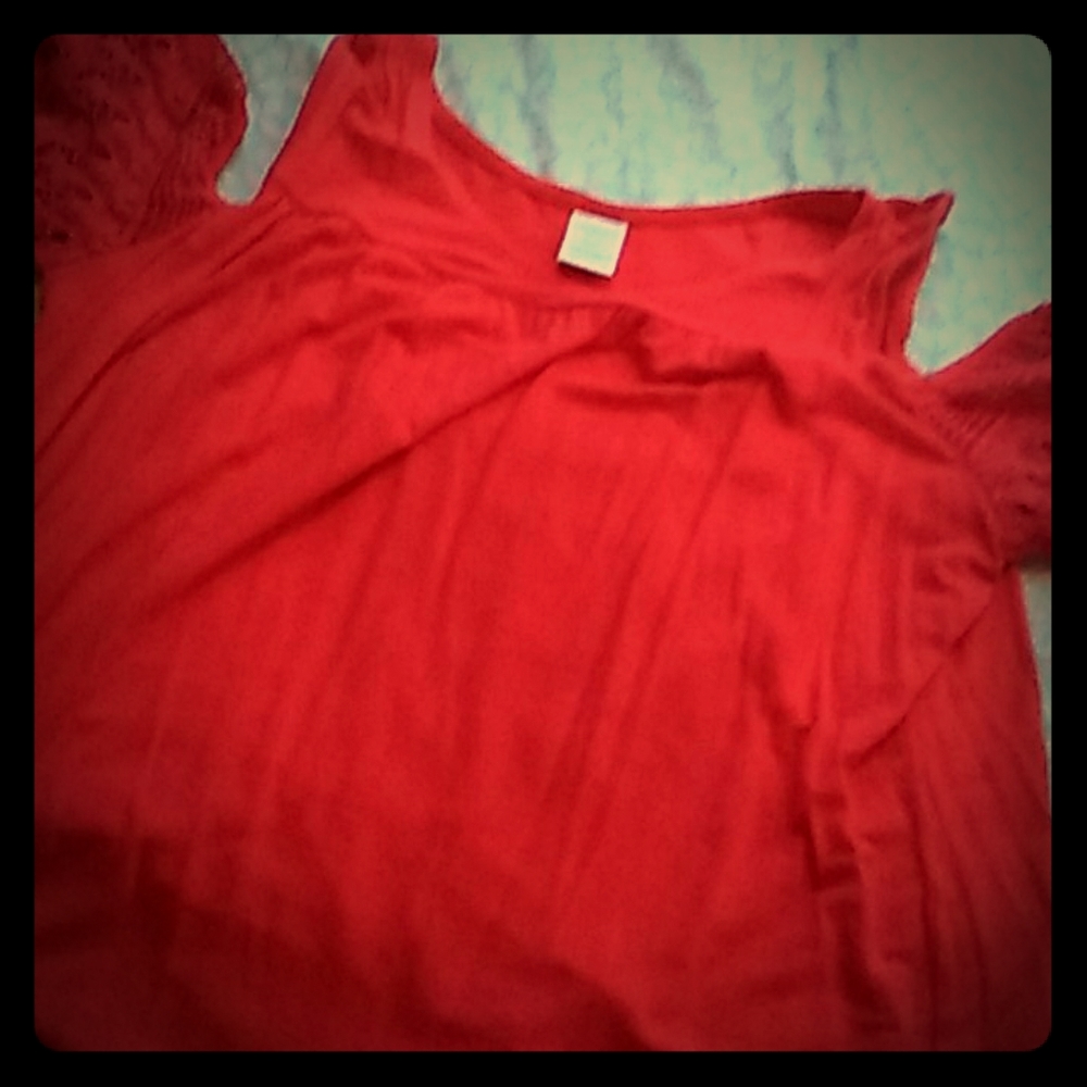 Shoulder showing red shirt